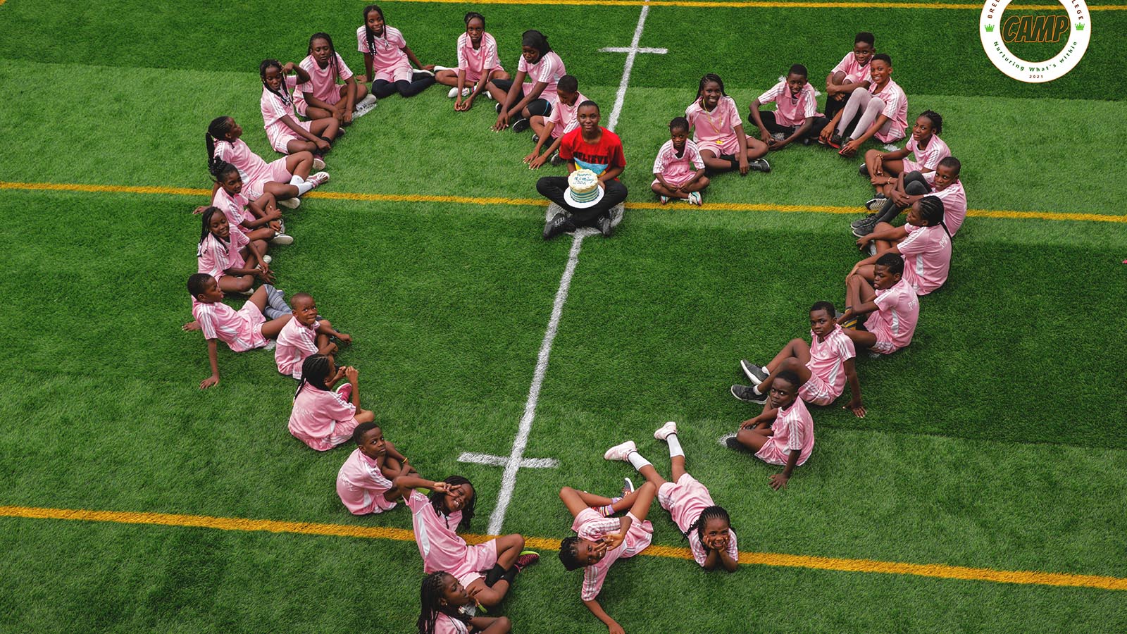 Campers celebrating on the field